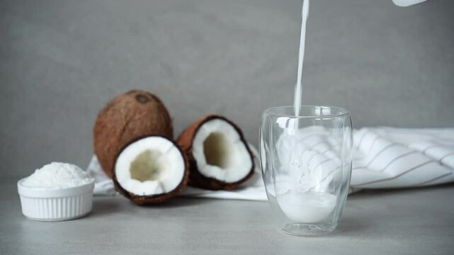 coconut milk is poured into a clear glass