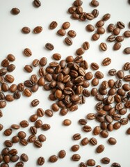 Freshly roasted coffee beans scattered on a light surface ready for brewing in a cozy kitchen