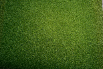 Vibrant Green Glitter Texture Background. Bright and sparkling green glitter texture with a soft...