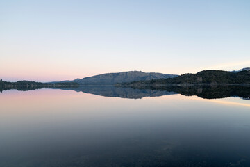 Panorama view of Lake Aluminé and the Andes mountains in the background, at sunset, in Villa Pehuenia, Patagonia Argentina.