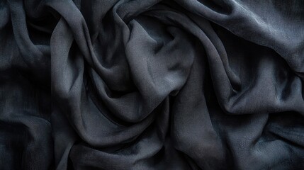 Fototapeta premium A rich black silk fabric flows elegantly in soft, smooth folds, revealing a serene texture. The interplay of light and shadow creates depth, inviting touch and enhancing sophistication in any setting.