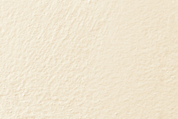 Cream concrete wall texture background. Uneven render stucco magnolia painted concrete wall texture background. Rough and grunge wall.