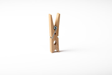 Wooden clothes peg isolated on white background
