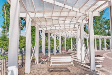 Wooden Circular Pergola with Swings in Strukovsky Garden park, Samara, Russia