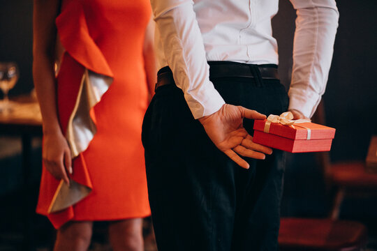 Man holding a present for his gilfriend on valentines day