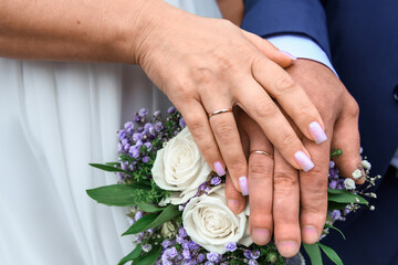 The hands of the newlyweds. A wedding in the moment of two.