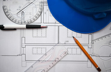 Architectural project planning involves using a blueprint, ruler, protractor, pencil and helmet to...