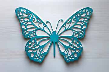 Fototapeta premium Intricate blue butterfly wall art with detailed cutout patterns on white background