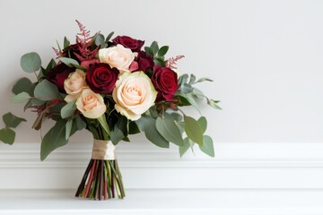 valentines day decor, a white frame rests on a clean shelf next to a vibrant bouquet of red roses in a beautifully decorated valentines day setting