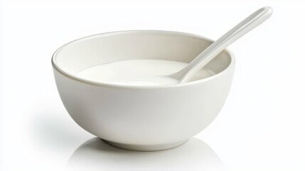  a white bowl filled with milk and a spoon resting on the surface The bowl is filled to the brim with the creamy white liquid, and the spoon is placed in the center