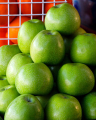 fresh healthy green apples fruits in a fruit basket in close up