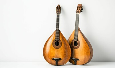 Two vintage stringed instruments, wooden bodies.