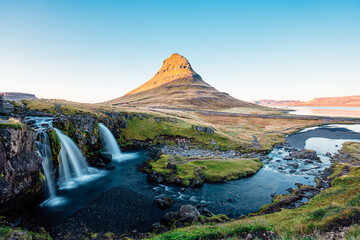 Golden light on the iconic Kirkjufell mountain in Iceland