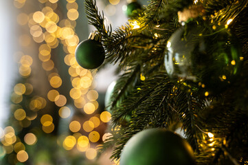 Christmas tree decorated with lights and balls. Bokeh