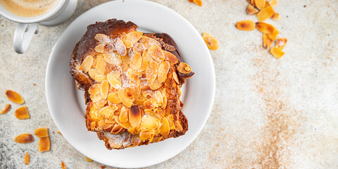 Brioche sweet almond french toast fresh tasty food dish delicious gourmet food background on the table rustic food top view copy space