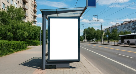 A poster at a bus stop on a city street, next to the roadway, features a blank white vertical billboard. The scene includes buildings and a road on a sunny summer day.