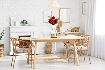 Vase with beautiful dahlias on dining table in living room
