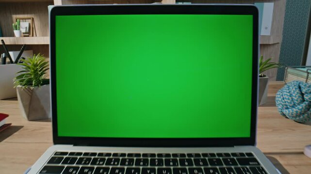 Freelancer touching mockup laptop touchpad browsing app at home office closeup