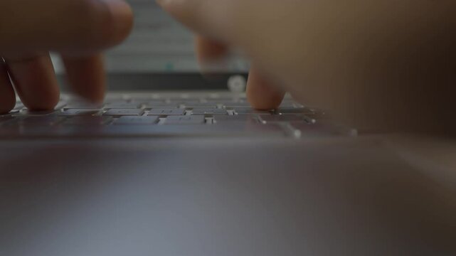 Closeup laptop keyboard type by two hand on white table
