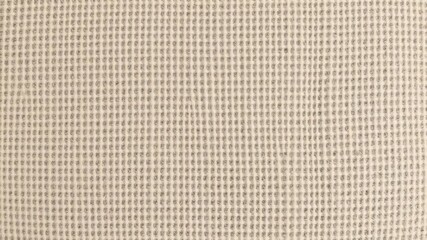 Fototapeta premium Close-up shot of canvas texture with visible weave, creating a rustic and natural look, pattern