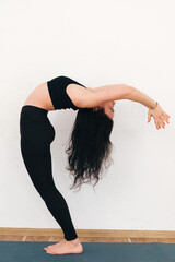Young attractive woman practicing yoga