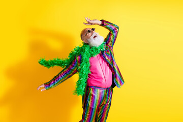 Photo of funky crazy man wear stylish striped clothes suit dance new year theme party isolated on yellow color background