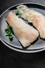 Raw fish fillet fresh tasty food dish delicious gourmet food background on the table rustic food top view copy space keto and paleo diet pescetarian