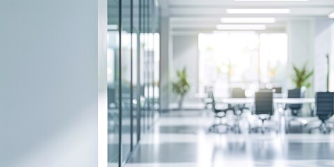 Fototapeta premium A bright and clean office space with glass walls, modern furniture, and a contemporary design.