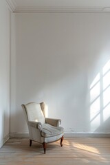 Fototapeta premium A vintage armchair sits in the sunlit corner of a room, illuminated by natural light.
