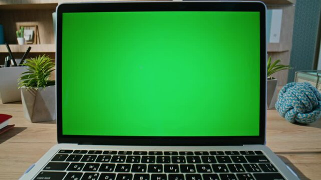 Laptop green screen standing at modern office closeup zoom in. Mockup computer