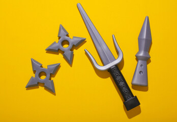 Ninja weapon play set on yellow background © splitov27