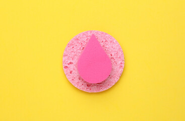 Pink Makeup Sponges on yellow Background