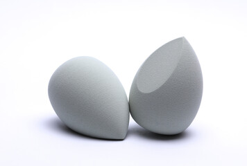 Eggs makeup sponges. Blenders for foundation on white background