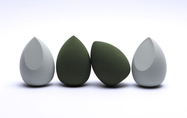 Eggs makeup sponges. Blenders for foundation on white background