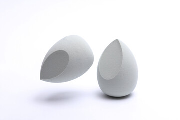 Eggs makeup sponges. Blenders for foundation on white background