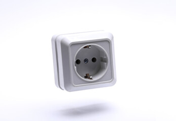 Electric socket floating on white background