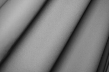 Fabric draping creates soft folds in monochrome tones in a serene setting