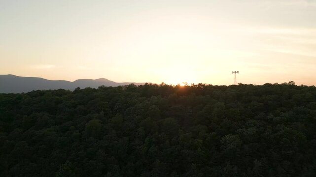 Beautiful golden hour landscape over the mountains, drone 4K
