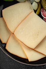 Raclette cheese tasty food dish fresh delicious gourmet food background on the table rustic food top view copy space top view