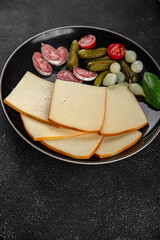 Raclette cheese tasty food dish fresh delicious gourmet food background on the table rustic food top view copy space top view