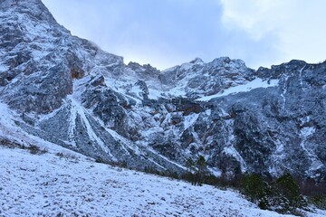Snow covered alpine landscape bellow the mountains at Ravenska Kočna in Gorenjska, Slovenia