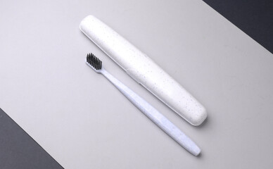 White plastic case for storing toothbrush