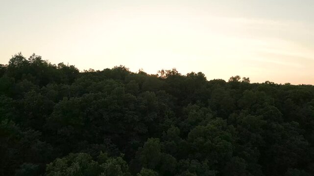 Beautiful golden hour landscape over the mountains, drone 4K