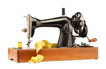 Sewing machine, measuring tape, safety pins and spools of threads isolated on white
