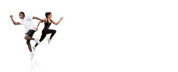 A young couple engages in a running workout, showcasing their energy and teamwork. They are dressed in athletic wear, completely focused and enjoying the exercise session.