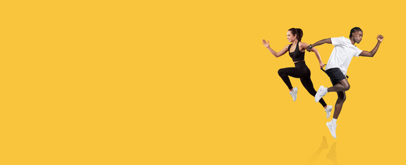 Two dynamic runners sprint with enthusiasm, showcasing their athleticism. They are focused and determined, highlighting an energetic workout environment perfect for fitness inspiration.