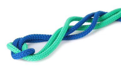 Colorful ropes tied in knot isolated on white. Unity concept