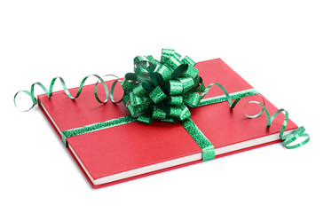 One book with green bow as gift isolated on white