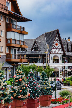 Cityscape of Gramado city during christmas season with alpine architecture, cars and christmas decorations
