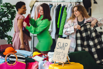 Students, young attractive people at home swap party, trying vintage clothes, bargain hunting....